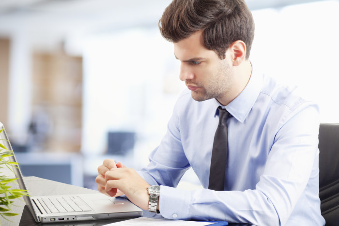 Young businessman working on laptop